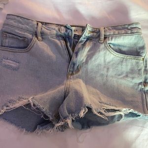 Light blue Jean shorts with a side rip